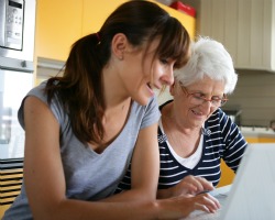 young woman and older woman at laptop